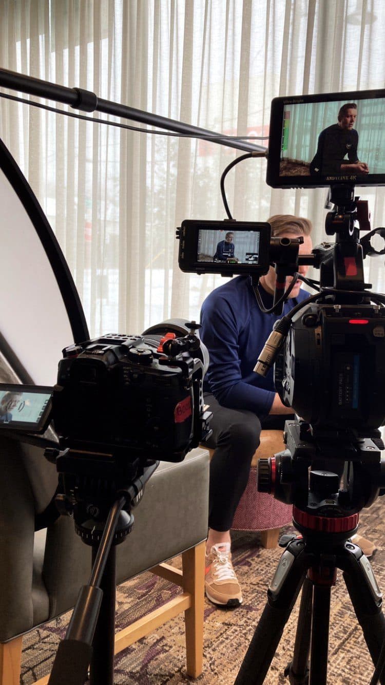 Monitor and camera framed on an interview subject