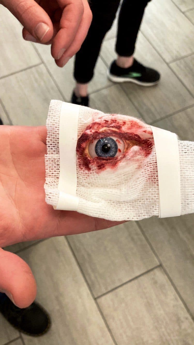 A prop eyeball held up between takes