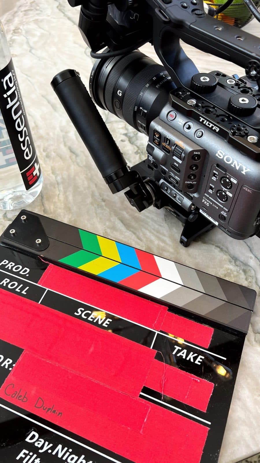 Camera and clapperboard on a table